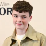 The British Heartthrob Who’s Taking Hollywood by Storm Owen Cooper looking effortlessly stylish in a casual yet chic outfit, exuding the British charm that has made him a breakout star in Adolescence.